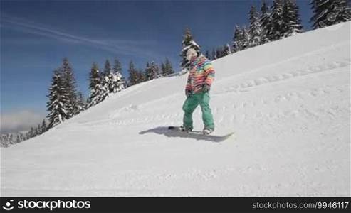 Snowboarder perform tricks