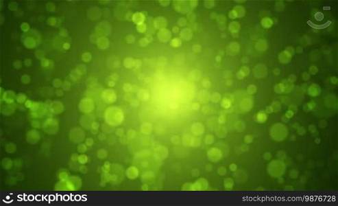 Soft green and gold bokeh motion background. Abstract spring concept.