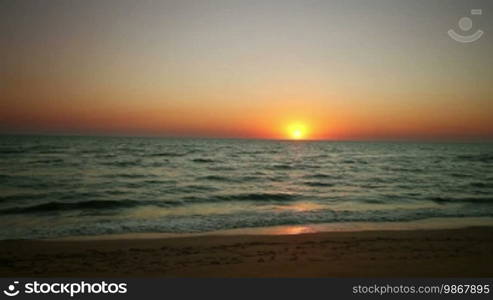 Sunrise with wave on beach