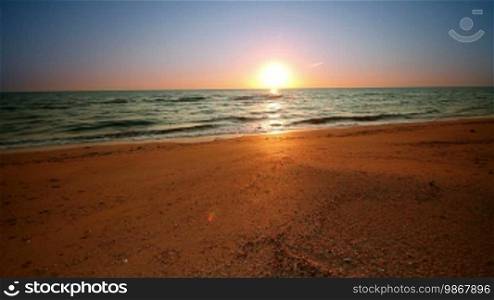 Sunrise with wave on beach
