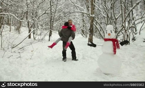 Teenage Couple Enjoying in Snow and Winter