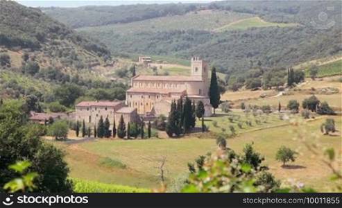 The medieval abbey of Sant'Antimo, Tuscany, Italy and the surrounding landscape and forests.