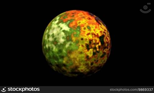 The planet slowly rotates, being surrounded by different colors on a black background.