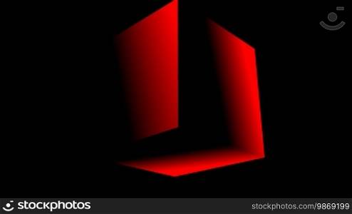 The red cube slowly rotates in darkness