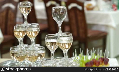 The waiter serving champagne at the reception