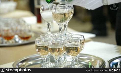 The waiter serving champagne at the reception
