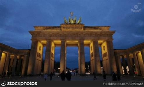 Time lapse night shot of Brandenburg Gate in Berlin, one of the most well-known landmarks of Germany