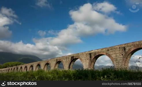 Time-lapse of clouds near the aqueduct and the mountain views in Italy, Tuscany