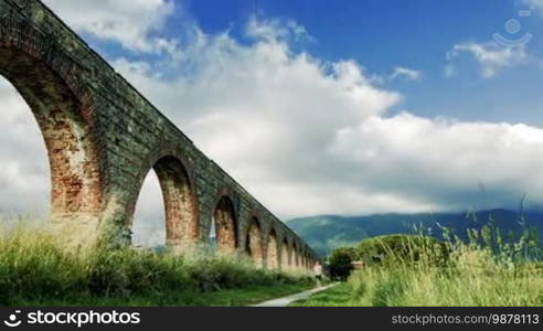 Time-lapse of clouds near the aqueduct and the mountain views in Italy, Tuscany