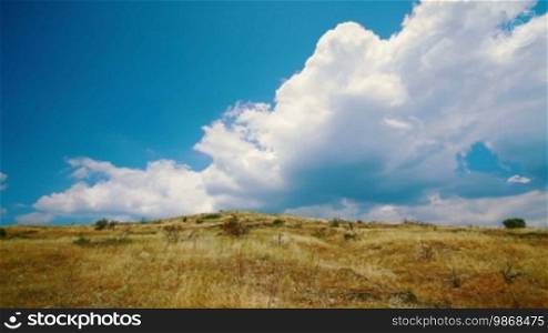 Time lapse of hilly cloudy landscape in summer