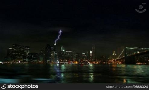Time-lapse of New York City skyline (South Street Seaport) at stormy weather, night shot