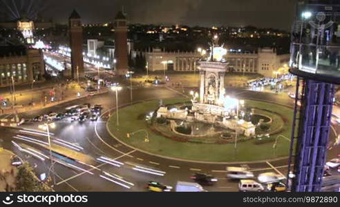 Time Lapse vehicles and pedestrians in the Plaza Spain in Fira de Barcelona. Main entrance of the Mobile World Congress Cars, trucks, motorcycles, bicycles, buses, taxis and pedestrians running through the streets of the city. Crowds moving through the streets of Barcelona. Urban nightlife in the big city.