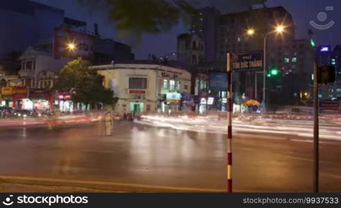 Timelapse shot of busy transport traffic on the junction of Hanoi at night, Vietnam