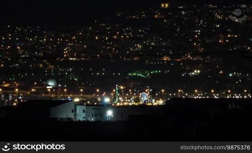 Timelapse shot of night city life. View to the electric lights in the darkness. Thessaloniki, Greece