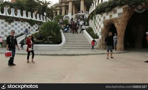 Tourists and staircase entrance, in Gnell Park, Barcelona.