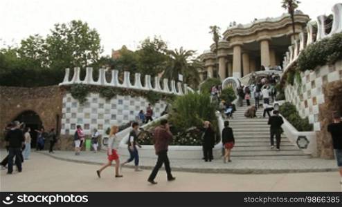 Tourists and staircase entrance, in Park Güell, Barcelona.