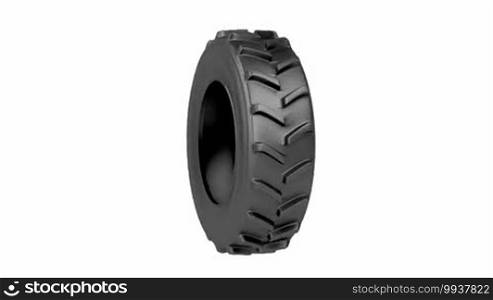 Tractor tire spins on white background