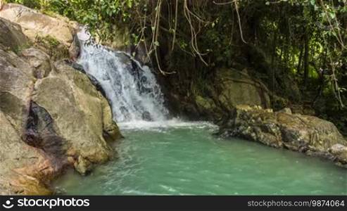 Tropical waterfall with mini lake in jungles loop