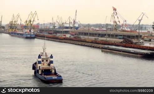 Tugboat floats in the port