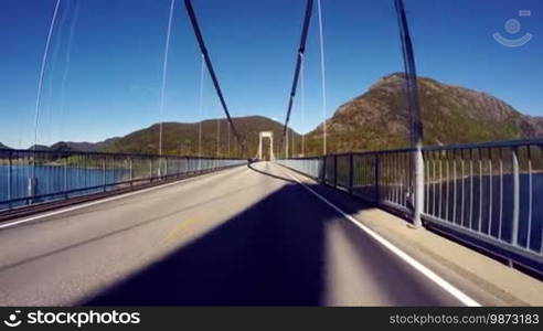 Vehicle point of view driving over the bridge.