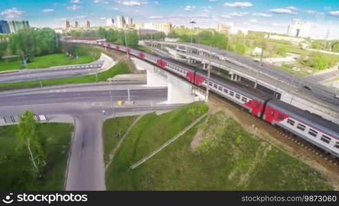 View from the bird's flight on the fast-moving train on the bridge near the junction