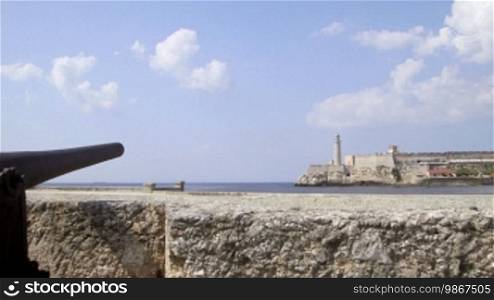 View of lighthouse and Morro castle in Havana, Cuba as seen from the Malecon promenade, with Caribbean sea. Sequence