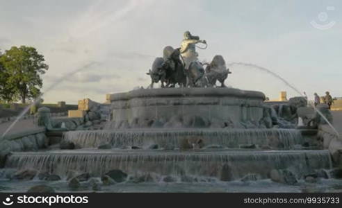 View to the grand Gefion Fountain, landmark of Copenhagen, Denmark. Sculpture of Norse goddess Gefjun with bulls on the top