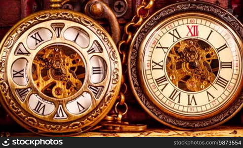 Vintage antique pocket watch against the background of old books