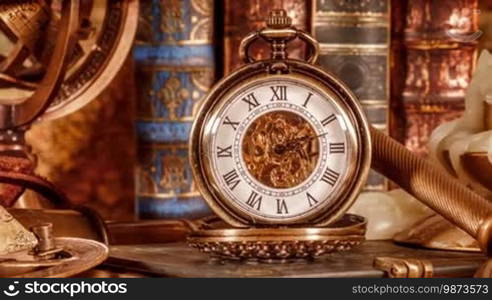 Vintage Antique pocket watch on the background of old books