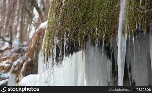 Waterfall Silver stream and mossy rock in winter. Grand Canyon, Crimea, Ukraine