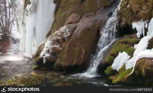 Waterfall Silver stream in winter. Grand Canyon, Crimea, Ukraine