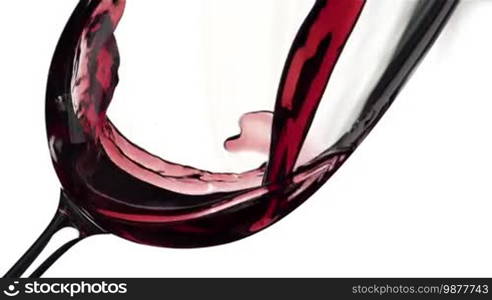 Wine is poured in a glass in super slow motion.