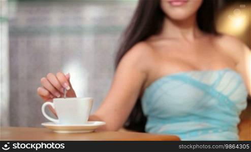 Woman drinking coffee in coffee shop