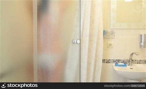Woman Having a Shower in Bathroom