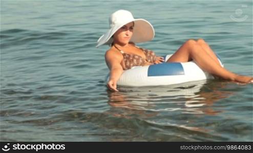 Woman on raft enjoying