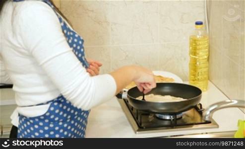 Woman preparing Chebureki (Crimean Tatar National Dish) at home
