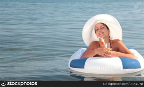 Woman relaxing in an inner tube