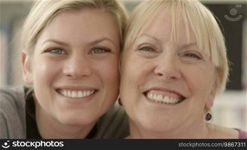 Women portrait with happy mom and daughter smiling, hugging, showing love and affection. Close up