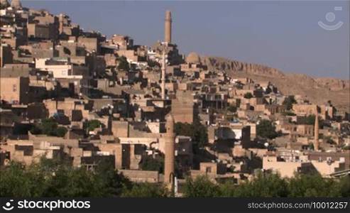 WS of Arabic town. 

Formatted: View of an Arabic town.