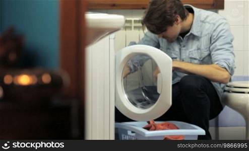 Young man doing laundry
