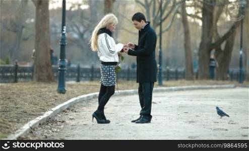 Young man proposing to a woman