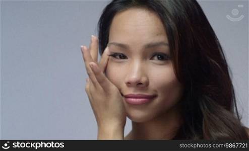 Young people, female teenager, woman, cosmetic, beauty and body care, portrait of happy Asian girl smiling, applying cream for eye skin therapy. 3 of 16