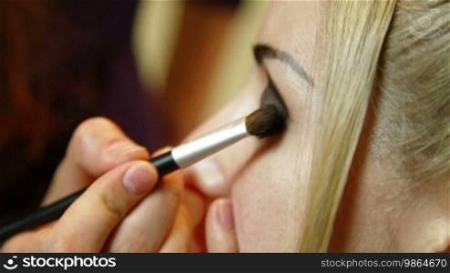 Young Woman Applying Makeup - Eyebrow and Eyeshadow