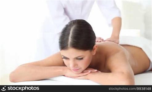 Young woman getting a massage at a spa session
