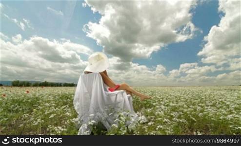 Young Woman on White Field in Summer - Tracking Shot