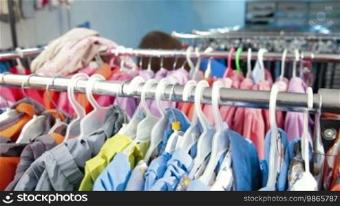 Young Woman Shopping For Clothes In Clothing Store