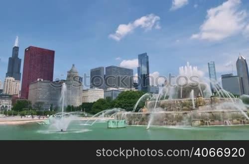 Video time lapse of Chicago downtown skyscrapers behind the Buckingham Fountain waters. The Willis Tower, the CNA Center, the Crain Communications Building or the Trump Tower are some of the skyscrapers in this shot. Awesome Chicago city center skyline in the United States of America.