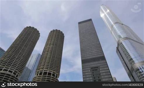 Video timelapse of Chicago downtown skyscrapers at the city center financial district. AMA Plaza and Trump Towers in Chicago city center in the United States of America. Sun reflecting on the skyscrapers glass.