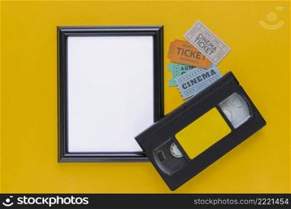 videotape with cinema tickets frame