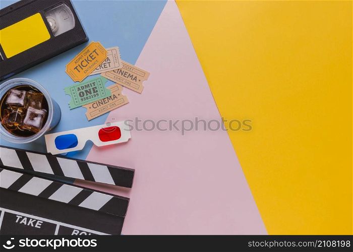 videotape with clapperboard cinema tickets